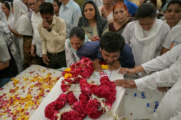 Relatives Wait For Remains After Air India Crash