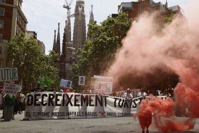 Holidaymakers sprayed by water pistols in Barcelona as part of organised anti-tourism protests across Europe