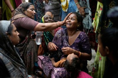 Grieving families face long wait for bodies of Air India crash victims