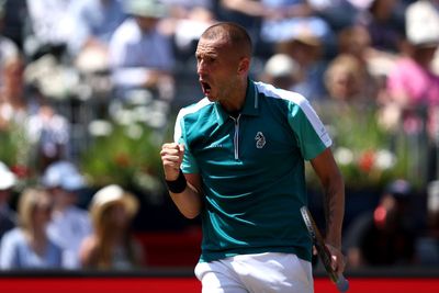 Dan Evans stuns Frances Tiafoe in first round at Queen's Club