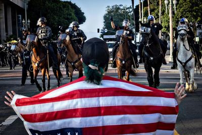 Ice agents detain US citizen as LA immigration raids continue: ‘It’s racial profiling’