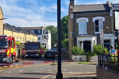 Woman found stabbed to death inside London house after gas explosion