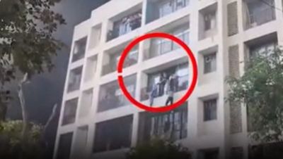 Shocking new video shows people leaping from building after Air India crash