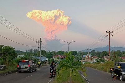 Dozens of Bali flights cancelled after volcano erupts in Indonesia