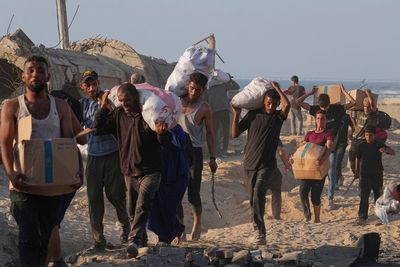 At least 59 Palestinians killed as Israelis accused of shelling at aid site