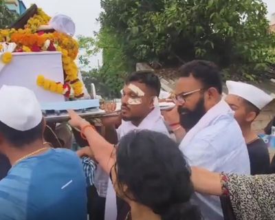 Air India survivor carries brother’s coffin amid questions over plane’s emergency systems