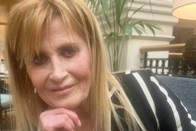 Woman, 66, arrested over death of film director linked to missing diamond-encrusted Rolex