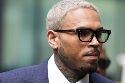 Chris Brown arrives at court to enter plea over ‘bottle attack’ charge
