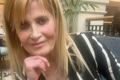 Woman charged with murder after film director stabbed to death in north London home