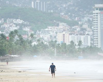 Weather tracker: Mexico’s Pacific coast hit by tropical storm and hurricane