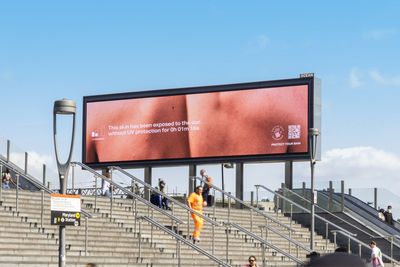 Burnable billboards use AI to show some scary truths