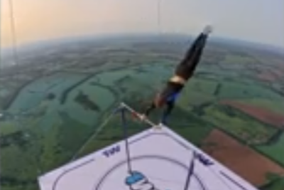 Russian daredevil performs gymnastics hanging from hot air balloon