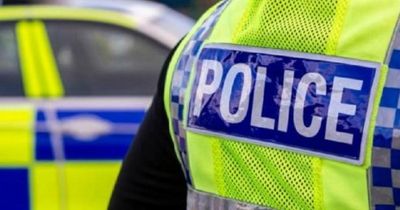 Baby taken to hospital and man arrested after armed police seal off street