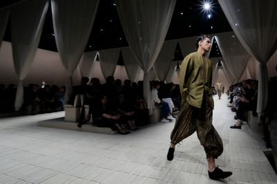 Armani's global aesthetic shines in bohemian Emporio Armani show, though designer misses Milan bow