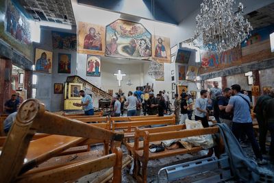 Priest describes moment suicide bomber entered Syria church before killing at least 22 worshippers