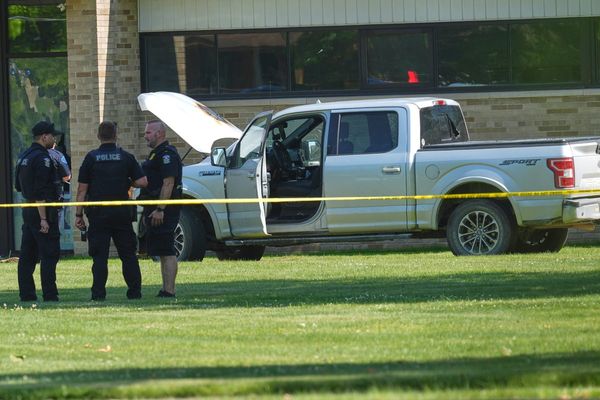 Man's mother is member of church where he opened fire outside before he was fatally shot, police say