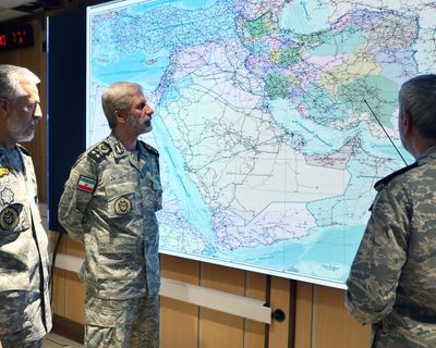 Iran and Israel launch intense wave of attacks as Trump talks of regime change