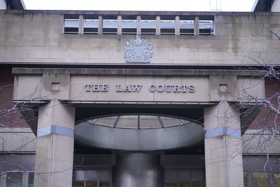 Woman admits trying to smother elderly mother with pillow in hospital bed
