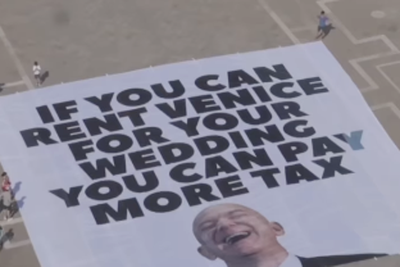 Protesters unfurl huge anti-Bezos banner in Venice ahead of Amazon billionaire’s wedding
