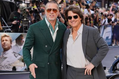 Brad Pitt embraces Tom Cruise at F1: The Movie premiere