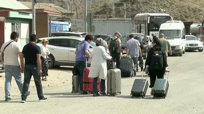 Fleeing airstrikes, Iranians seek relief in neighboring countries