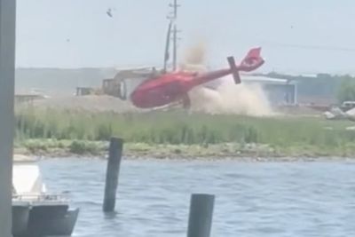 Watch: Moment helicopter flips and crash lands outside Michigan restaurant