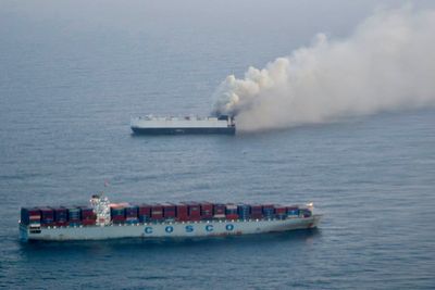 Cargo ship carrying new vehicles sinks in international waters