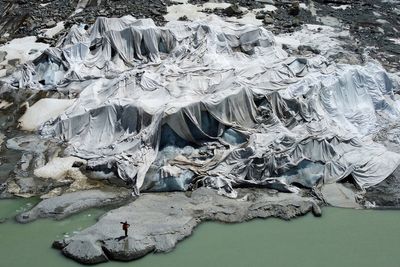 Photos show Swiss glaciers' uncertain future as 'ambassadors of climate change'