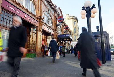 Armed police officers swoop after man is stabbed at rush hour near west London Tube station