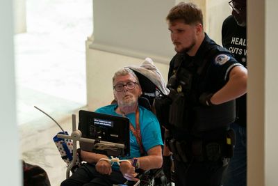 Protesters in wheelchairs cuffed with zip-ties during Capitol demonstrations against Medicaid cuts