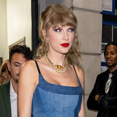 Taylor Swift Subtly Outfit Repeats in a $495 Denim Corset Dress for a Surprise Performance of "Shake It Off"