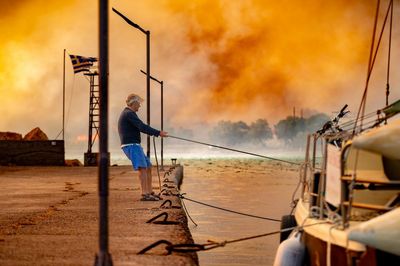 Greece wildfires: woman charged with unintentional arson after cigarette allegedly started blaze on Chios