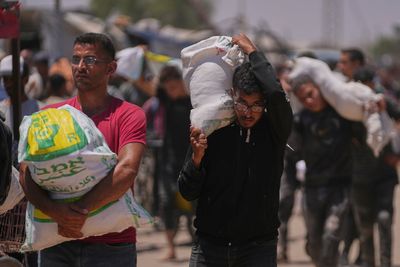 An Israeli strike kills 18 Palestinians in central Gaza as turmoil mounts over food distribution
