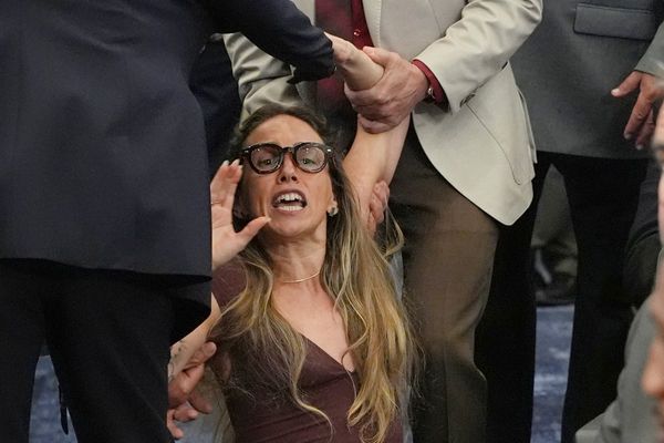 Shocking scenes as woman dragged out of meeting for trying to speak during hearing on ICE rules