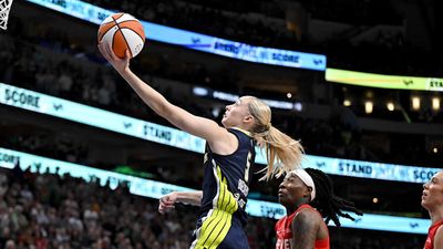 Paige Bueckers Dapped Up Mavericks’ Kyrie Irving Mid-Game During Fever-Wings