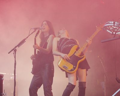 Haim’s secret Glastonbury set review – sing-alongs and stomping songs from Worthy Farm’s favourite sisters