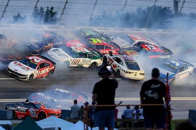 NASCAR halts Atlanta Cup race after huge crash collects half the field