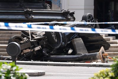 Young man fighting for his life after car flips onto roof in horror crash at Piccadilly Circus roundabout