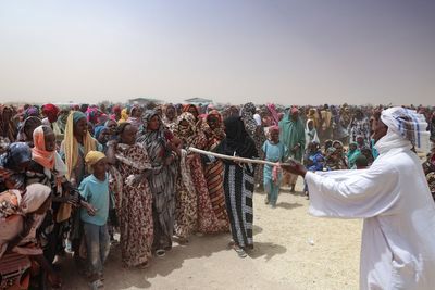 Photos show Sudanese refugees who have fled to neighboring Chad in their hundreds of thousands