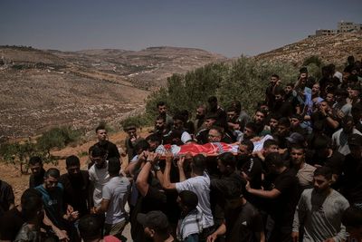Israeli settlers rampage at a military base in the West Bank
