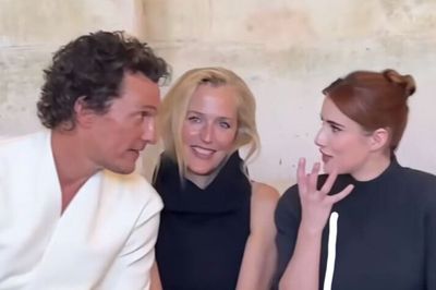 Matthew McConaughey and Emma Roberts appear to talk over Gillian Anderson at Paris Men’s Fashion Week
