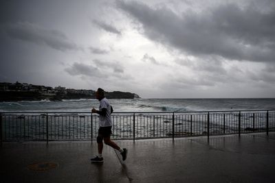 Australia bomb cyclone live: Coastal residents told to ‘evacuate now’ as powerful storm halts flights