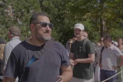 Man sleeps overnight on a dog bed in queue for Wimbledon tickets