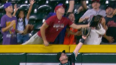 Diamondbacks Fan Cannot Stop Reaching Over the Fence to Initiate Umpire Reviews