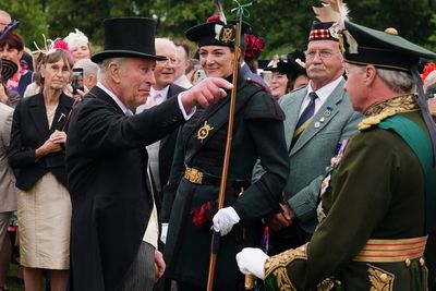 King and Queen begin Holyrood Week under guard of ceremonial female bodyguards