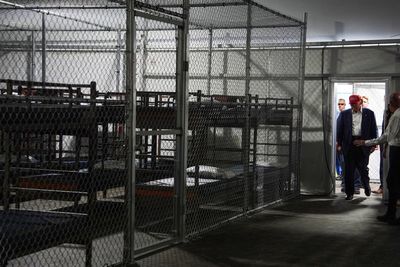 Photos of Trump touring an immigration detention center dubbed 'Alligator Alcatraz'