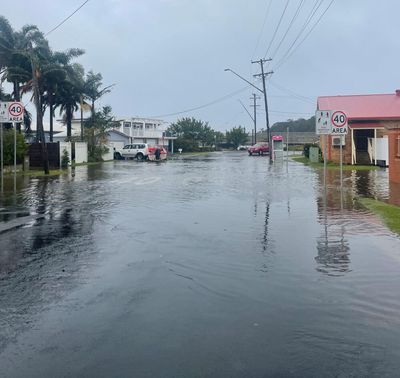 Floods, wild winds and power cuts: inundated NSW south coast holiday haven braces for more heavy rain