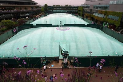 Photos show the rain on Day 3 after the Wimbledon heatwave