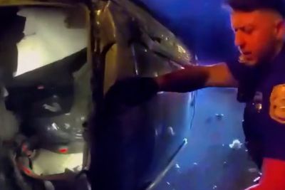 Florida police smash through glass to rescue woman from car inferno