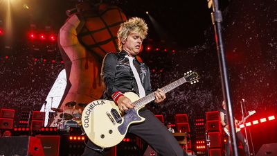 Billie Joe Armstrong is very much not having the time of his life as he says 'Good Riddance' to fan who gets on stage and plays an Oasis song instead of the 1997 Green Day hit they were supposed to